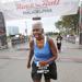 Lorraine Cephus crossing the Philly half marathon line