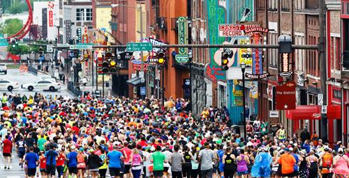 runners heading through downtown nashville