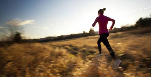 female runner dashing through a frame