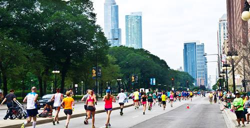 image of runners racing through the city