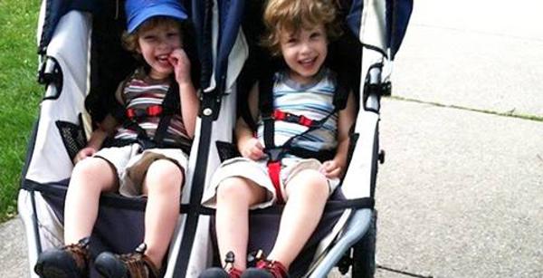 two kids in a stroller