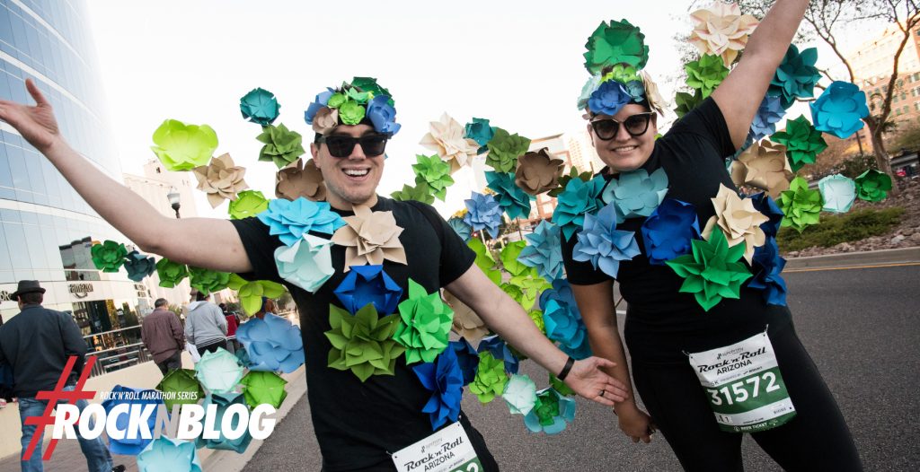 two runners covered in origami flowers 