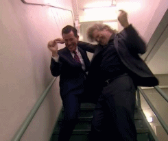 2 guys dancing in stairwell gif