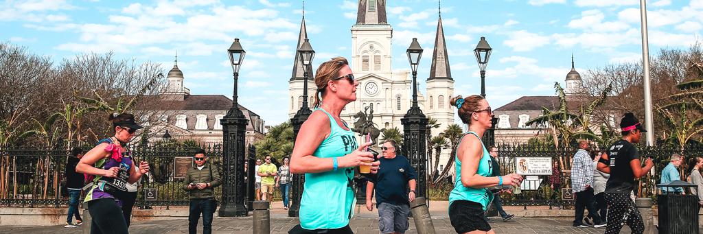Runners in front of Jackson Square