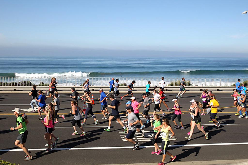 Runners in front of ocean